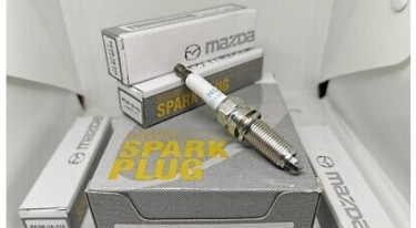 Brand New Set Of 4 Genuine Mazda PE5R Spark Plugs