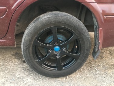 15 Black Rims And 15/195/60 Tires