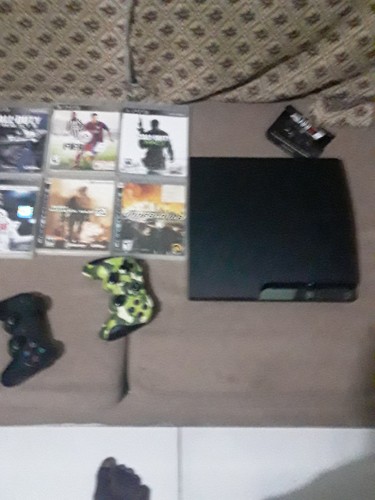 PlayStation 3 With 9 Games With 3 Controllers     