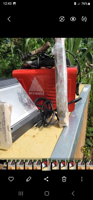 Arc Welding With Helmet And Rod For Sale